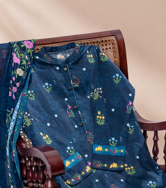 Navy blue wildflower print lawn kurta draped over a dark wooden cane chair