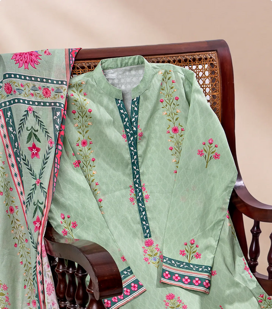 Sage green printed lawn kurta draped over a dark wooden cane chair with floral voile dupatta