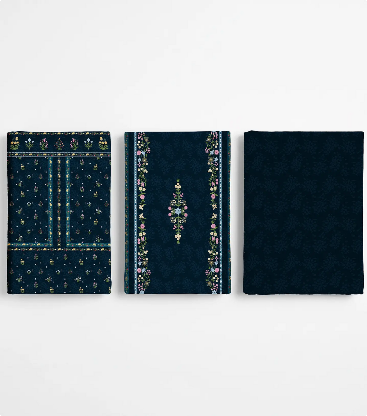 Three folded unstitched navy blue lawn pieces with wildflower motifs and floral borders