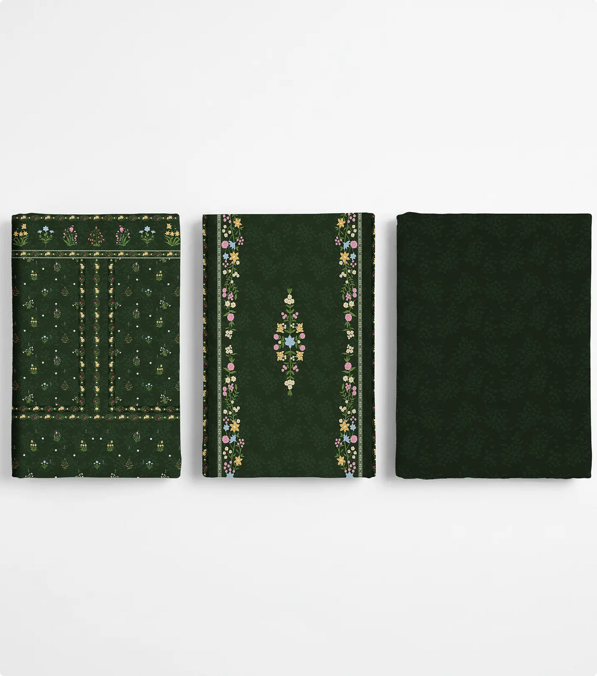 Three folded unstitched forest green lawn pieces with wildflower motifs and floral borders