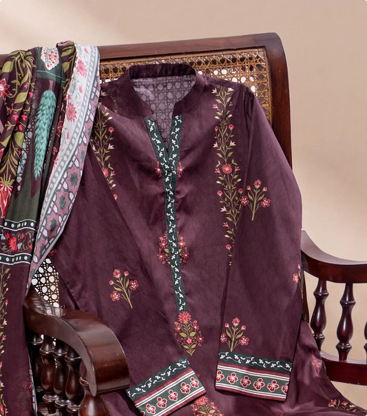 Burgundy printed lawn kurta draped over a dark wooden cane chair with floral voile dupatta