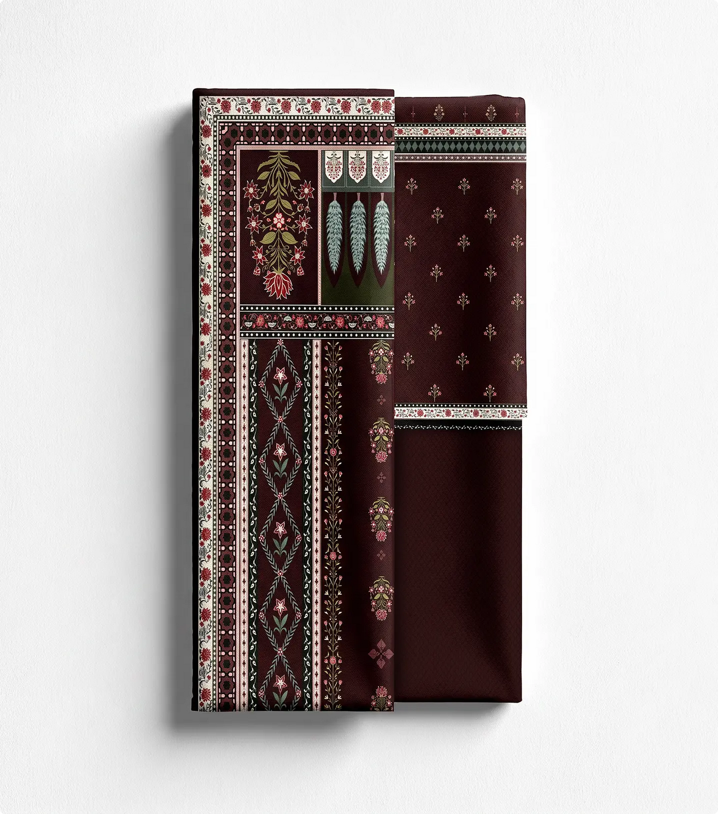 Unstitched burgundy lawn shirt panel with floral border print beside matching trouser fabric