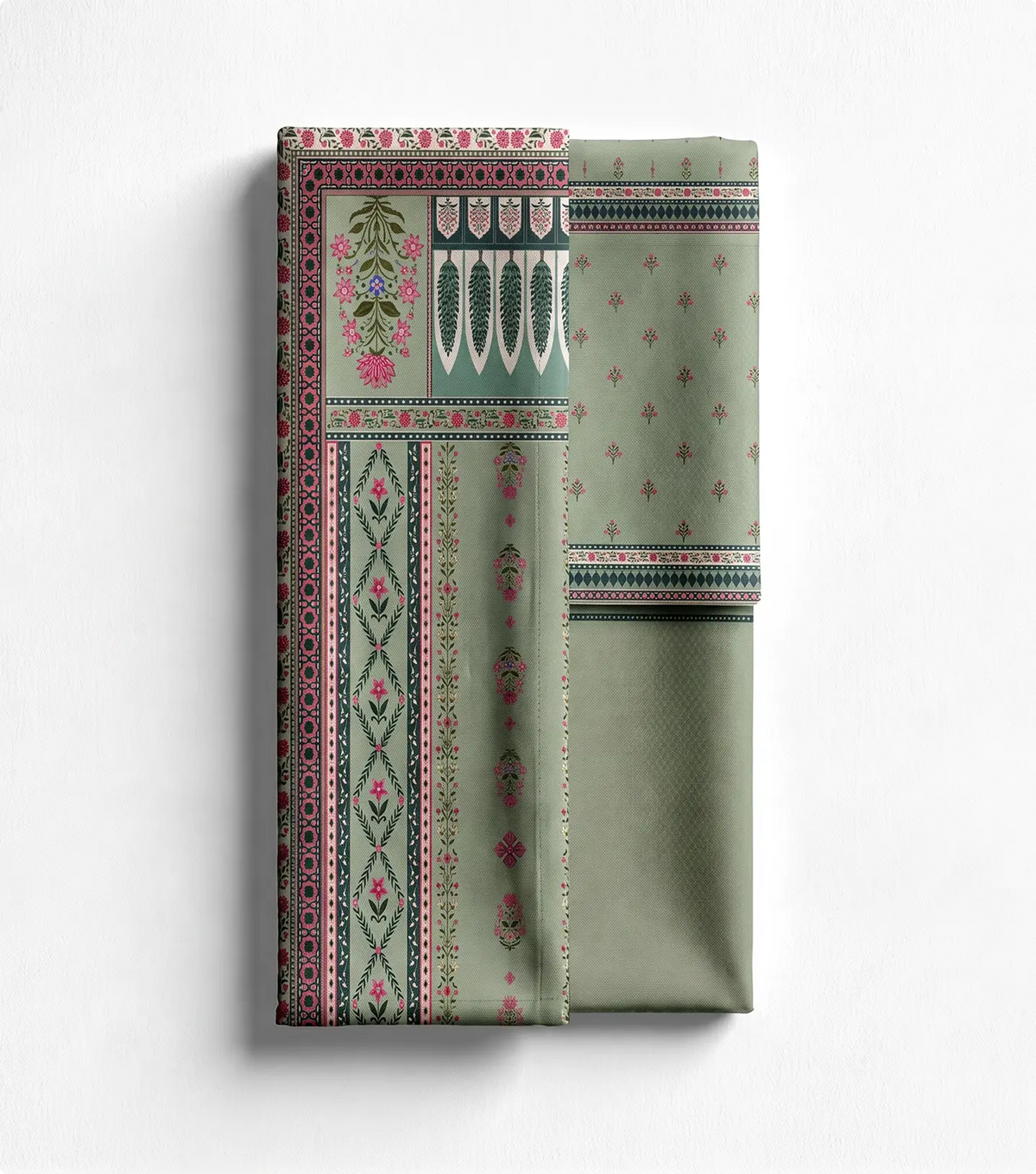 Unstitched sage green lawn shirt panel with floral border print beside matching trouser fabric